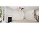 Cozy living room with a fireplace, neutral carpet and large windows at 13224 Tolstoy, Covington, GA 30014