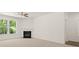 Bright living room with a fireplace, neutral carpet and large windows at 13224 Tolstoy, Covington, GA 30014