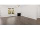 Spacious living room with hardwood floors and fireplace at 13224 Tolstoy, Covington, GA 30014