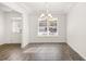 Bright and airy living room with hardwood floors and a large window at 13224 Tolstoy, Covington, GA 30014
