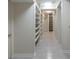 Spacious basement hallway with built-in shelving and neutral flooring at 139 W Paces Ferry Nw Rd, Atlanta, GA 30305