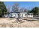 Attractive, single-story brick home with a manicured lawn and mature trees at 139 W Paces Ferry Nw Rd, Atlanta, GA 30305