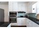 Contemporary kitchen with black countertops and stainless steel appliances at 139 W Paces Ferry Nw Rd, Atlanta, GA 30305