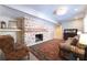 Cozy living room features exposed brick fireplace and comfortable seating at 139 W Paces Ferry Nw Rd, Atlanta, GA 30305