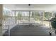 Relaxing porch with white wood railings, bench seating, and a grill for outdoor cooking at 139 W Paces Ferry Nw Rd, Atlanta, GA 30305