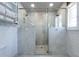 Luxurious bathroom with a marble shower, glass doors, and built-in shelving at 139 W Paces Ferry Nw Rd, Atlanta, GA 30305