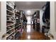 Spacious walk-in closet with custom shelving and ample storage space for clothing and shoes at 139 W Paces Ferry Nw Rd, Atlanta, GA 30305