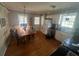 Cozy eat-in kitchen featuring wooden floors and ample natural light from the windows at 2111 Kinridge Trl, Marietta, GA 30062