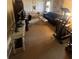 Spacious living room features ample seating, a work area, and plenty of natural light, perfect for relaxing or working from home at 2111 Kinridge Trl, Marietta, GA 30062