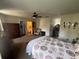 Main bedroom featuring a ceiling fan, dresser, and closet, providing ample space for relaxing and storage at 2111 Kinridge Trl, Marietta, GA 30062