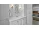 Elegant bathroom featuring a marble countertop, white cabinetry, and modern lighting at 3814 Vermont Ne Rd, Atlanta, GA 30319