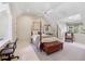 Cozy bedroom featuring a four-poster bed, a window seat, and hardwood floors at 3814 Vermont Ne Rd, Atlanta, GA 30319
