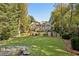 Elegant home surrounded by lush landscaping with a sprawling green lawn, offering a serene outdoor setting at 3814 Vermont Ne Rd, Atlanta, GA 30319