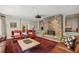 Cozy living room featuring a stone fireplace, comfortable seating, and an oriental rug at 3814 Vermont Ne Rd, Atlanta, GA 30319