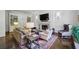 Cozy living room with a fireplace, built-in bookshelves, and comfortable seating at 3814 Vermont Ne Rd, Atlanta, GA 30319