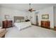 Bright main bedroom featuring hardwood floors, a seating area, and neutral decor at 3814 Vermont Ne Rd, Atlanta, GA 30319