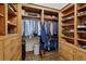 Large custom wood walk-in closet with ample storage space, shelving, and drawers for organization at 3814 Vermont Ne Rd, Atlanta, GA 30319