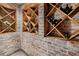 Rustic wine cellar with brick walls and wooden racks showcasing an organized collection of wines at 3814 Vermont Ne Rd, Atlanta, GA 30319