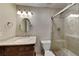 Elegant bathroom featuring granite counters, and a shower with glass door at 4614 Blakedale Cir, Roswell, GA 30075