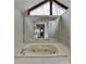 Spacious bathroom featuring a large triangular window and a soaking tub at 4614 Blakedale Cir, Roswell, GA 30075