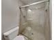 Well-lit bathroom features a glass-enclosed shower and modern toilet at 4614 Blakedale Cir, Roswell, GA 30075