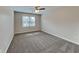 Inviting bedroom featuring a ceiling fan and natural light from a window at 4614 Blakedale Cir, Roswell, GA 30075