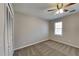 Comfortable bedroom with carpet, neutral walls, and a ceiling fan with lights at 4614 Blakedale Cir, Roswell, GA 30075