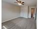 Comfortable bedroom featuring a ceiling fan, plush carpeting and neutral walls at 4614 Blakedale Cir, Roswell, GA 30075