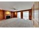 Spacious living room with hardwood-style paneling, built in bookshelves, fireplace and neutral carpet at 4614 Blakedale Cir, Roswell, GA 30075