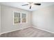 Neutral-toned bedroom with carpet, ceiling fan, and natural light at 832 Toonigh Rd, Canton, GA 30115