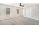 Bright and airy bedroom with neutral walls, plush carpeting, and double windows for natural light at 832 Toonigh Rd, Canton, GA 30115