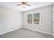 Bright bedroom with neutral walls, carpeted floor, and natural light at 832 Toonigh Rd, Canton, GA 30115