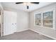 Well-lit bedroom featuring neutral walls and a carpeted floor at 832 Toonigh Rd, Canton, GA 30115