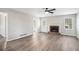 Spacious living room featuring a fireplace, modern flooring, and abundant natural light at 832 Toonigh Rd, Canton, GA 30115