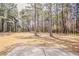 Expansive backyard with mature trees, ideal for outdoor activities and relaxation at 1621 Annapolis Way, Grayson, GA 30017