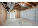 Spacious unfinished basement with exposed beams, concrete walls, and potential for customization at 1621 Annapolis Way, Grayson, GA 30017