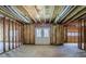 Unfinished basement with exposed ductwork, a door and a garage door at 1621 Annapolis Way, Grayson, GA 30017