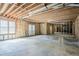 Unfinished basement featuring concrete floor and walkout French doors at 1621 Annapolis Way, Grayson, GA 30017