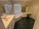 Spacious primary bathroom with a soaking tub, double vanity, and plenty of counter space at 1621 Annapolis Way, Grayson, GA 30017