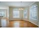 Bright dining area with hardwood floors, large windows, and a modern light fixture at 1621 Annapolis Way, Grayson, GA 30017