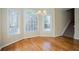 Bright dining area with hardwood floors, large windows, and a modern light fixture at 1621 Annapolis Way, Grayson, GA 30017