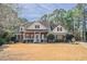 Charming two-story brick home with a inviting front porch and manicured landscaping at 1621 Annapolis Way, Grayson, GA 30017