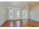 Bright living room featuring hardwood floors, ample natural light, and neutral walls at 1621 Annapolis Way, Grayson, GA 30017