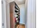 A closet with a dark wood shelf for storing shoes and other accessories at 361 Watson Ave, Woodstock, GA 30189