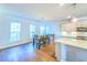 A spacious dining area with natural light, adjacent to a stylish modern kitchen space at 361 Watson Ave, Woodstock, GA 30189