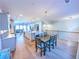 Dining area with hardwood floors and an adjacent kitchen, connected to the living space at 361 Watson Ave, Woodstock, GA 30189