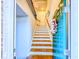 Entryway showcases a staircase with patterned runners, blending functionality with eye-catching design at 361 Watson Ave, Woodstock, GA 30189