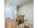 Second-floor landing area with hardwood floors, a mirror, and views of the upstairs hallway at 361 Watson Ave, Woodstock, GA 30189