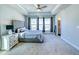 Spacious main bedroom with lots of natural light, a trey ceiling, and soft carpeted floors at 361 Watson Ave, Woodstock, GA 30189