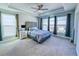 Spacious main bedroom with lots of natural light, a trey ceiling, and soft carpeted floors at 361 Watson Ave, Woodstock, GA 30189